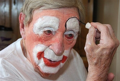 &lt;p&gt;In this March 29, 2012, photo, Floyd &quot;Creeky&quot; Creekmore puts on his makeup before a visit with children at a circus in Billings, Mont. Guinness World Records has anointed the world's oldest performing clown, and it's none other than Creekmore, a former Montana rancher who's been donning the big nose and bright makeup for almost eight decades. (AP Photo/Matthew Brown)&lt;/p&gt;