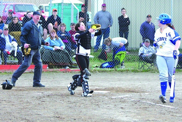 &lt;p&gt;Catcher Samijo Kinzie of the Plains softball team (center) making an out on a pop fly hit by Dayln Germany of Libby. Umpire Dan Heisler (left) is observing the out.&lt;/p&gt;