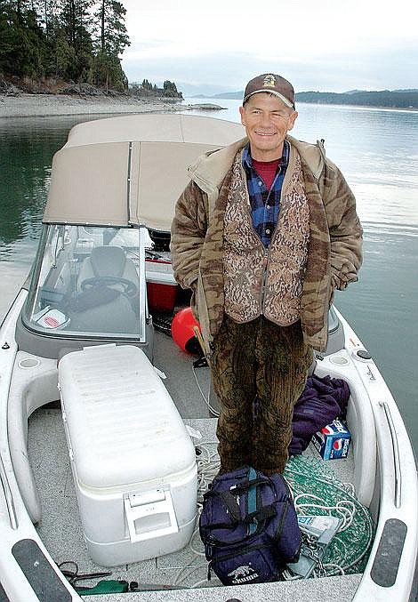 Stanley Ross stands on his boat Saturday morning at Somers Bay on Flathead Lake. Ross, of Kalispell, was preparing for a day of fishing in the spring Mack Days fishing tournament, which is designed to help reduce the population of non-native lake trout in Flathead Lake. Ross is the holder of the former world rainbow trout record, for a fish caught in the Kootenai River. Dave Reese/Special to the Inter Lake