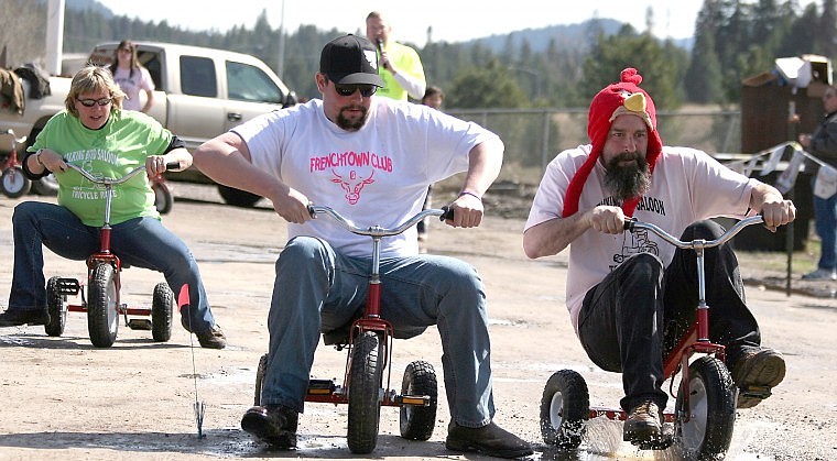 &lt;p&gt;Jim Maston of St. Regis (right) makes a move past competitors during the ninth annual Talking Bird Trike Races.&lt;/p&gt;