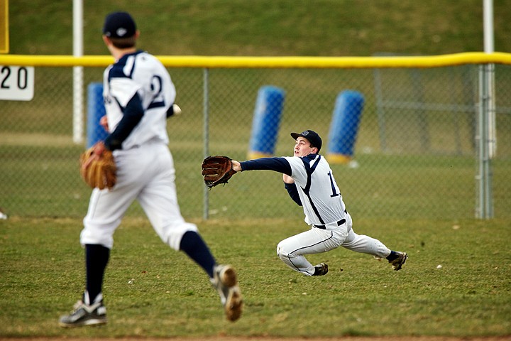 &lt;p&gt;Lake City High's Taylor Combo gets under a shot to left field to get the out during the fourth inning.&lt;/p&gt;