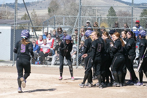 The team waits to congratulate Duford on her home run