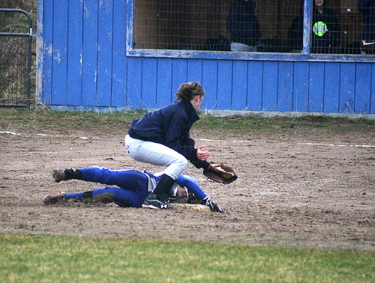 Erickson slides under the tag