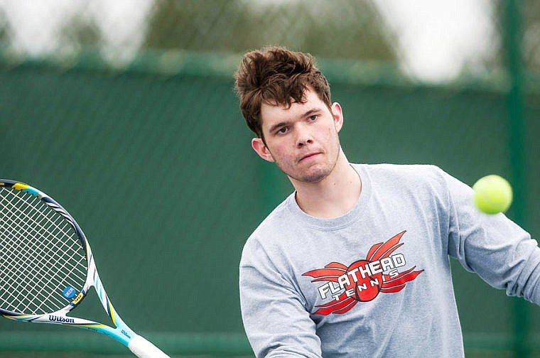 &lt;p&gt;Flathead senior Connor Roetigg eyes the ball as he prepares to return a serve Saturday afternoon during his No. 1 singles match against C.M. Russell&#146;s Asad Khattak at Flathead Valley Community College. Khattak won 7-5, 7-5.&lt;/p&gt;