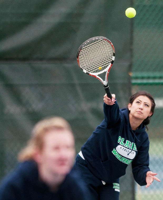 &lt;p&gt;Glacier senior Gabbie Ruis serves the ball during her doubles match with partner freshman Caitlin Ward (left) Saturday afternoon against Great Falls at Flathead Valley Community College.&lt;/p&gt;