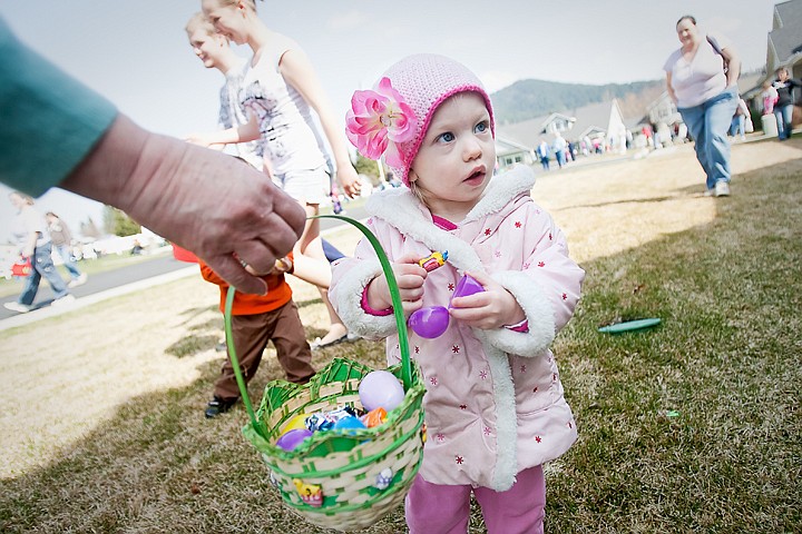 &lt;p&gt;JULIA MOORE/Press Camrynn Rouw, 2, opens an easter egg during the Four Seasons Assisted Living's Easter egg hunt Saturday afternoon in Coeur d'Alene.&lt;/p&gt;