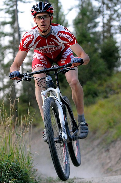 <p>Levi Hoch gets a workout with his mountain bike during a trail ride at Herron Park on Sept. 11.</p>