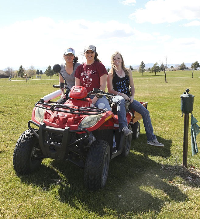 &lt;p&gt;Brooklyn Olson, coach Paige DeLaurenti and Kaitlyn Woirhaye pose while cleaning up the course.&lt;/p&gt;