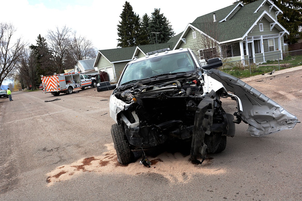 &lt;p&gt;ELLIOTT NATZ Lake County Leader The city truck that was hit by a Buick Tuesday afternoon rests in the intersection of 4th Ave. and Buchanan Street in Ronan. The red Buick rolled after colliding with the truck, coming to rest against the first garage in the back and a car parked in the driveway.&lt;/p&gt;