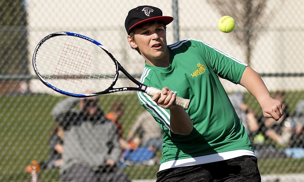 &lt;p&gt;Lakeland's Tyler Sterritt angles his tennis racket to return the ball to Post Fall's Hunter Scherzo on Wednesday at Lakeland High.&lt;/p&gt;