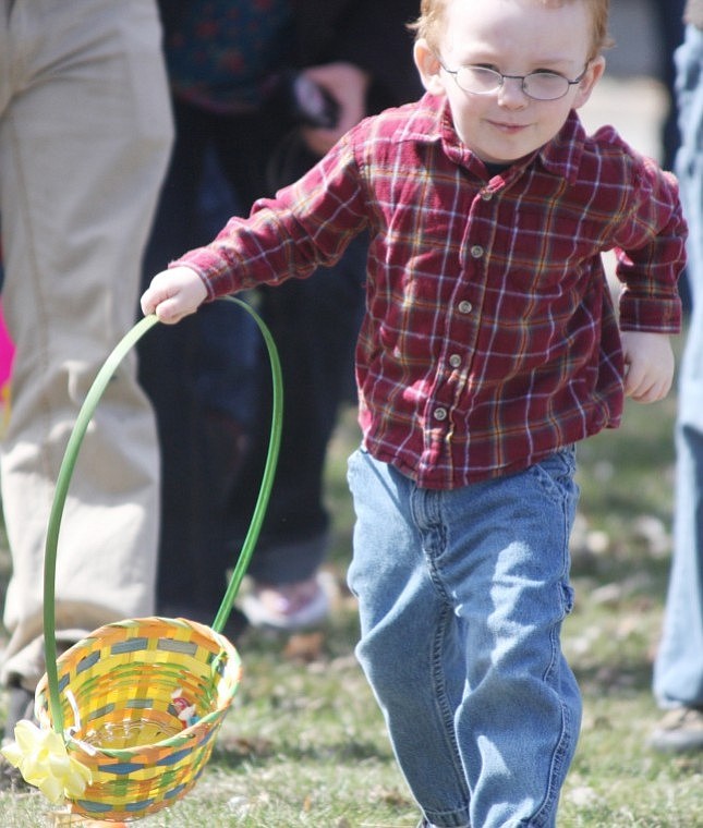 Logan Steinebach charges forward to collect Easter eggs at the annual egg hunt in Plains, put on by the Plains Lions Club.