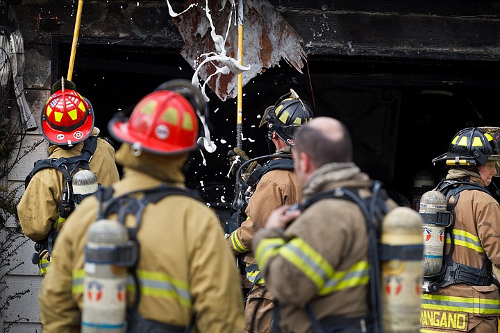 &lt;p&gt;Kootenai County Fire and Rescue firefighters pull sections of the eve looking for hot spots Wednesday after responding to a fire that originated in the garage of a Post Falls home. One man was transported to Kootenai Medical Center to be treated for burns.&lt;/p&gt;