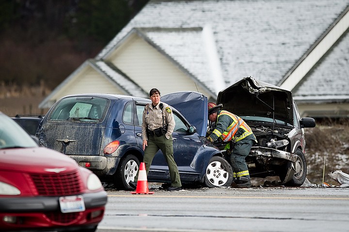 &lt;p&gt;Alana Hunt, Kootenai County Sheriff's Deputy, helps Idaho State Police and Northern Lakes Fire Protection District crews on the scene of Tuesday's multiple vehicle accident on U.S. 95.&lt;/p&gt;