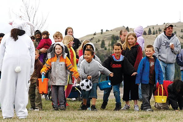 Children four years of age and over line up to start an Easter Egg Hunt Saturday at Dayton Park. The chilly weather cut the festivities short by a few hours.