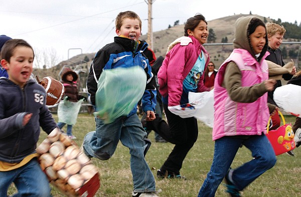 Children four years and older run to search for Easter Eggs Saturday during the 5th annual Easter Egg Hunt at Dayton Park. 50 dozen eggs were painted for the event.