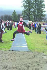 With a leap of determination, Cody Robertson tries his hand at the long jump.