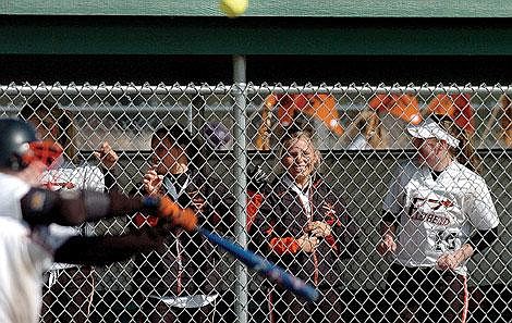 Brianna Compton bats while, from left to right, Kourtney Corpron, Kalin Lingele, Christina Zorn and Julie Robertson look on during Flathead's first game of a double header against Missoula Sentinel on Friday at Kidsport. Compton drove in the game-winning run as Flathead won 2-0. Chris Jordan/Daily Inter Lake