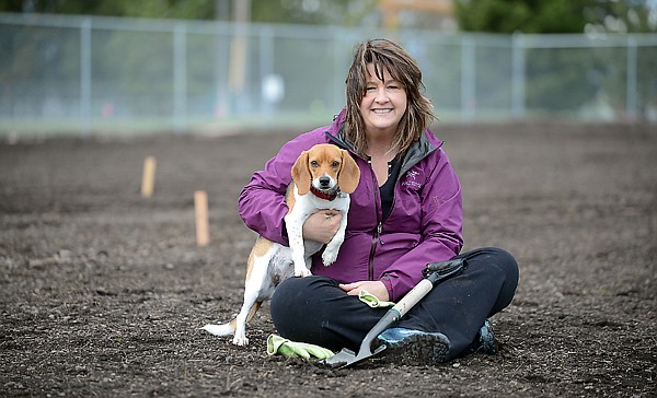 <p>Shari Johnson and her dog Maija at the site of the future Wildcat Peace Garden on Friday, April 5, in Columbia Falls. (Brenda Ahearn/Daily Inter Lake)</p>