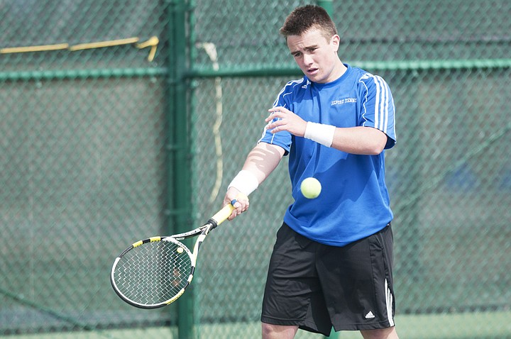 <p>Bigfork’s Colter Mahlum returns a serve during a singles match with Flathead’s Andrew Klingensmith at Flathead Valley Community College Monday afternoon.</p>