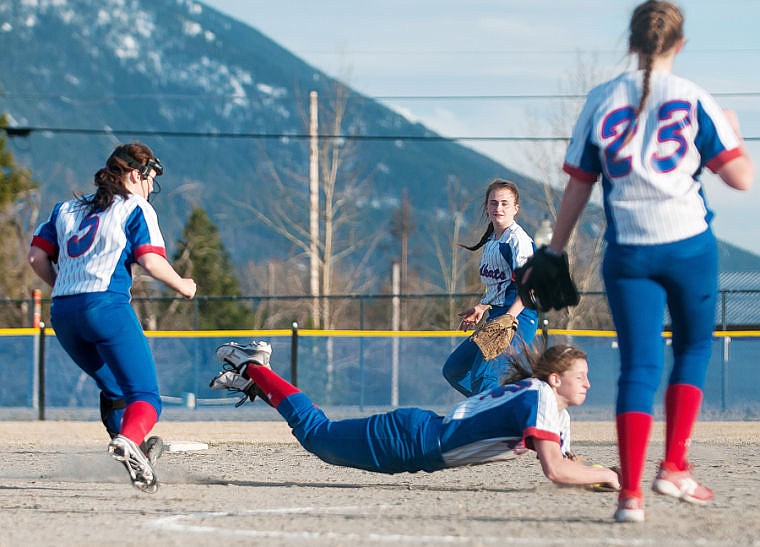 &lt;p&gt;Columbia Falls senior shortstop Winter Kemppainen (center) makes a diving catch in the seventh inning Tuesday night during the Wildkats' loss to Polson at Columbia Falls High School. April 8, 2014 in Kalispell, Montana. (Patrick Cote/Daily Inter Lake)&lt;/p&gt;