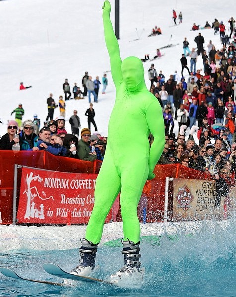Billy Marcial puts his fist up in the air as he skims across the pond.
