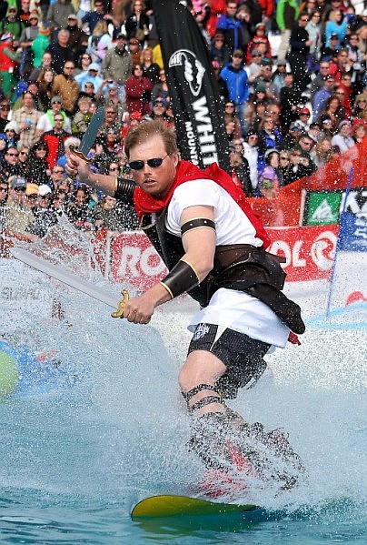 Dressed as a gladiator, David Gosnell carves his way through the water.