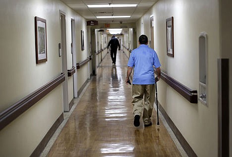 &lt;p&gt;In this March 11 photo, a patient walks down a hallway at the Fayetteville Veterans Affairs Medical Center in Fayetteville, N.C. The VA hospital is one of the most backed-up facilities in the country.&lt;/p&gt;