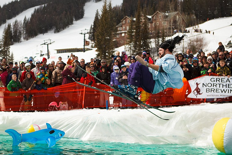 <p>Patrick Cote/Daily Inter Lake Josh Carpenter dressed as the Big Mountain Jesus Statue for the 7th Annual Pond Skim at Whitefish Mountain Resort. Saturday, April, 7, 2012 in Kalispell, Montana.</p>