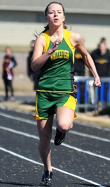 Whitefish's Amanda Foley charges down the track during a heat of the 100-meter race.