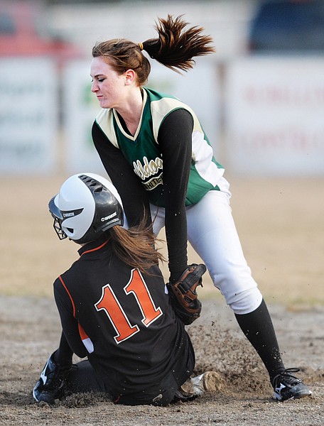 Flathead&#146;s Alexa Mrgich slides into second base under Whitefish&#146;s Madison Tveidt during the nonconference softball game in Whitefish on Tuesday.