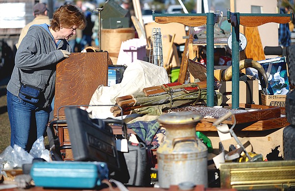 Diana Larsen of Bigfork looks over merchandise at the 44th annual Creston Auction and Country Fair on Saturday morning.