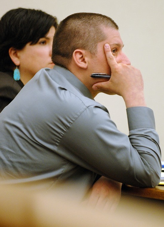 Juan Miguel Vasquez, 28, sits in Flathead County District Court next to public defender Nicole Ducheneaux Thursday afternoon.