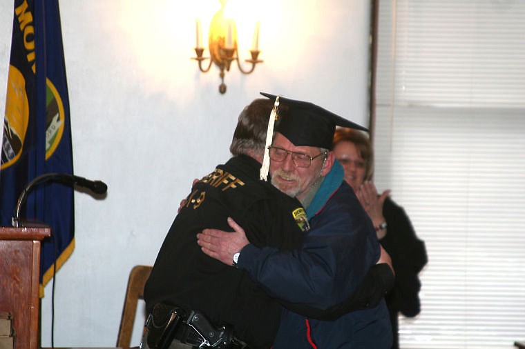 &lt;p&gt;Wally Schrock hugs Deputy Jim Balenger, who arrested him over a year ago, at his graduation from the Mineral County DUI/Drug Treatment Court on Wednesday.&lt;/p&gt;