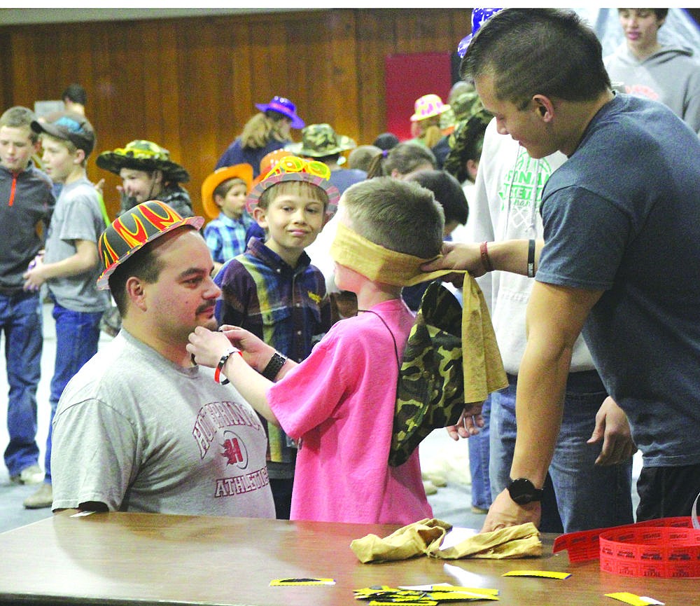 &lt;p&gt;Principal Chris Clairmont (left) takes part in one of the games at last week's reading carnival in Hot Springs.&lt;/p&gt;