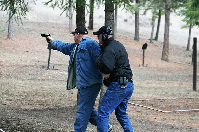 &lt;p&gt;Richard Hogt, left, receives one-on-one training from Tom Ewing at his shooting range in St. Regis.&#160;&lt;/p&gt;