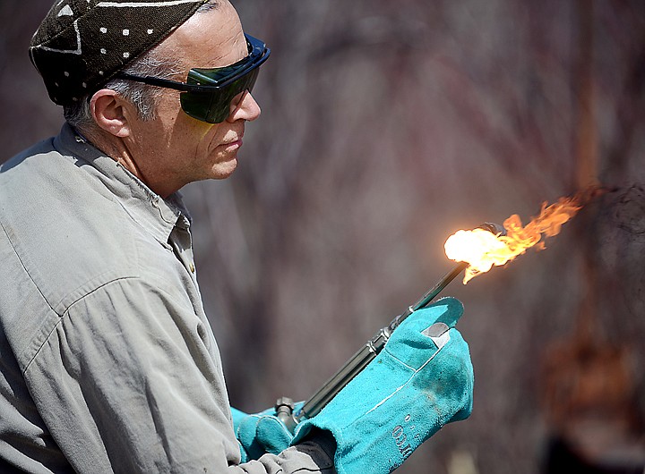 &lt;p&gt;Jeffrey Funk, a blacksmith/artisan who lives near Echo Lake, lights a cutting torch on Thursday for preparation work to take down the Old Steel Bridge.&lt;/p&gt;&lt;p&gt;&lt;/p&gt;