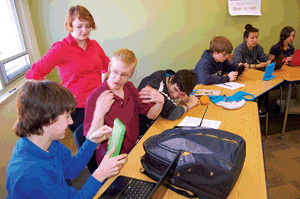 &lt;p&gt;From left to right, Clayton York, Rayanna Sherman, Devin Reiter, Jeffrey Krieger, Eli Pine, Ines Bougatef and Victoria Smith check out the iPad Minis they&#146;ll be using in a special class conducted in association with Panhandle Animal Shelter. (Photo by CAMERON RASMUSSON)&lt;/p&gt;