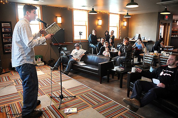 Robby Cale reads a poem to the crowd at the Boiler Room on Sunday, March 6, in Kalispell.