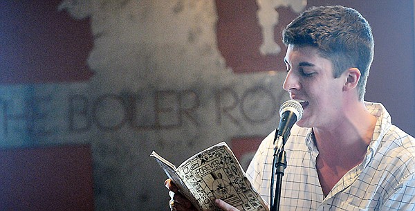 Robby Cale reads a poem to the crowd at the Boiler Room on Sunday, March 6, in Kalispell.