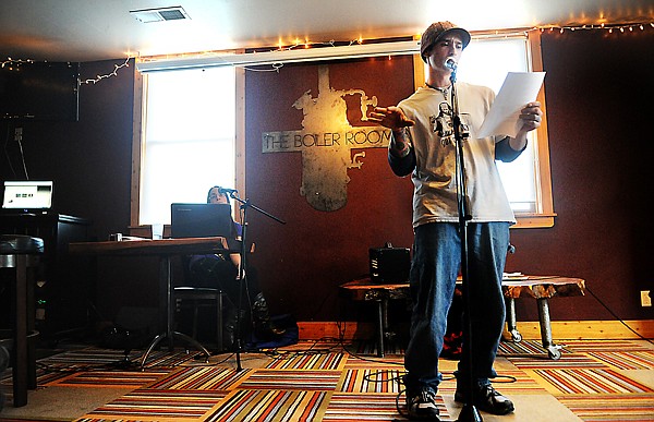 Mat Lee reads one of his poems on Sunday, March 6, at the GET POETRY Open Mic event at the Boiler Room. Mat has been doing videography and webcasting for the events. That Sunday was his first week as host of the event.