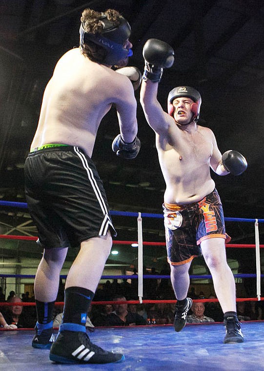 &lt;p&gt;Flathead senior Axel Bladholm (right) knocks the mouthpiece out of Columbia Falls&#146; Spencer Ross Thursday night during the fifth annual Crosstown Smoker at the Flathead County Fairgrounds Trade Center. Bladholm won by unanimous decision.&lt;/p&gt;