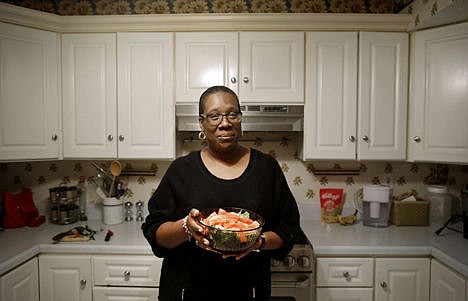 &lt;p&gt;Michele Rouse holds a salad that she made in her kitchen in Edgewood, Md., April 3. Rouse says she has lost 7 pounds since she started on Weight Watchers a month ago and has already seen a drop in her elevated blood pressure.&lt;/p&gt;