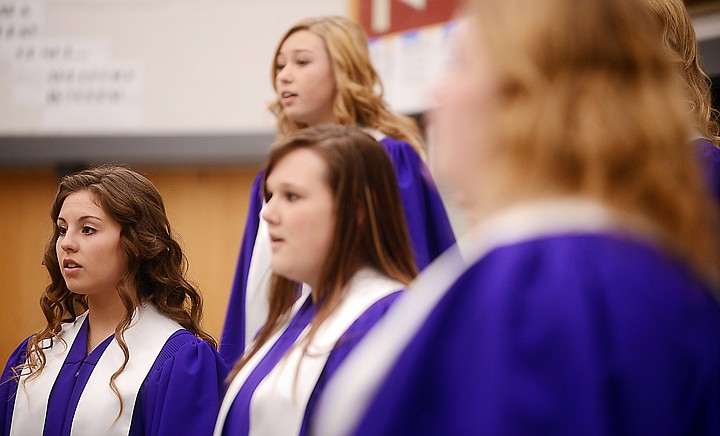<p>Polson sophomore Lydia Dupuis, left, and members of the Polson Select Women's Choir sing Tatkovina on Friday, April 11, at Flathead High School. (Brenda Ahearn/Daily Inter Lake)</p>