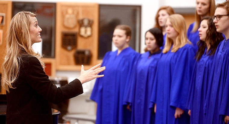 <p>Judge Lynn Ryan, a choir teacher at C.M. Russell High School, gives pointers to students from Bigfork following their performance at the District Music Festival on Friday, April 11, at Flathead High School. Ryan's first job as a teacher was 11 years ago at Bigfork. (Brenda Ahearn/Daily Inter Lake)</p>