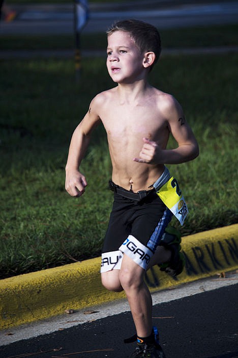 <p>Reid Roberts heading toward the finish line at the 2014 Tallahassee Youth Sport Triathlon in Tallahassee, September 2014. The 6-year-old Tallahassee resident regularly competes in kids triathlons with his siblings.</p>