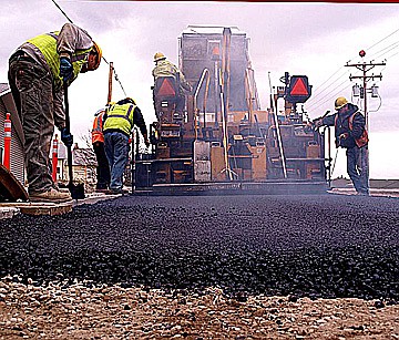 &lt;p&gt;Crew members work to pave 1st Avenue East as part of the Skyline Drive improvement project, which is set to wrap up in September.&lt;/p&gt;