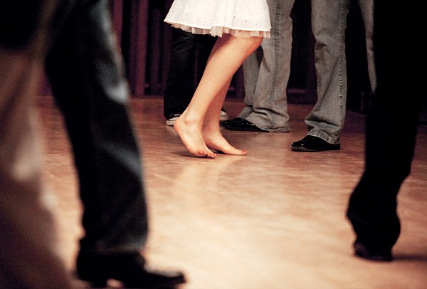 Brenda Ahearn/Daily Inter Lake
A dancer takes of her shoes at a social dance at the Sassafras Ballroom in Kalispell on Friday, April 2.