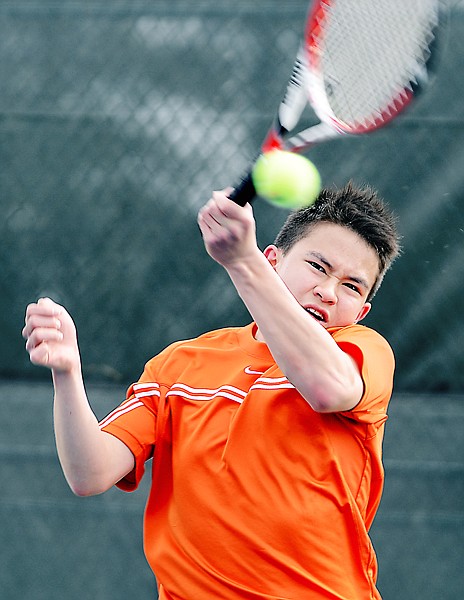 &lt;p&gt;Flathead's Glenn Strickler makes a return during his No. 1 singles match with defending state champion Kellen Bates of Glacier during the crosstown tennis dual on Thursday at Flathead Valley Community College.&lt;/p&gt;