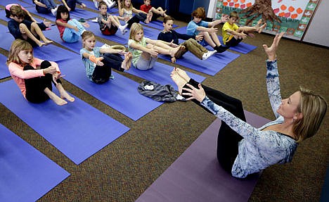 &lt;p&gt;Yoga instructor Kristen McCloskey, right, leads a class of third graders at Olivenhain Pioneer Elementary School in Encinitas, Calif., Dec. 11, 2012.&lt;/p&gt;