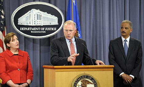 &lt;p&gt;Attorney General Eric Holder, right, and Sharis Pozen, acting assistant attorney general, Antitrust Division, left, listens as Connecticut Attorney General George Jepsen speaks during a news conference at the Justice Department in Washington, Wednesday, April 11, 2012. The Justice Department and several states have sued Apple Inc. and major book publishers, alleging a conspiracy to raise the price of electronic books that Attorney General Eric Holder says cost consumers millions of dollars. (AP Photo/Cliff Owen)&lt;/p&gt;